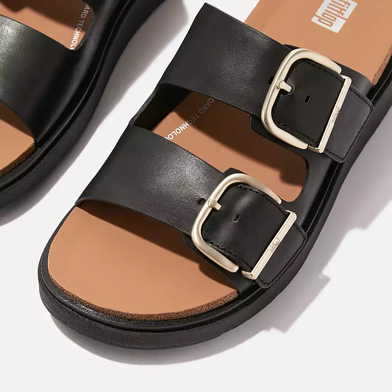 FITFLOP | SANDÀLIES DONA | GEN FF BUCKLE TWO BAR LEATHER SLIDES BLACK | NEGRE